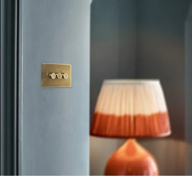 Lucian two gang dimmer switch in aged brass in GB